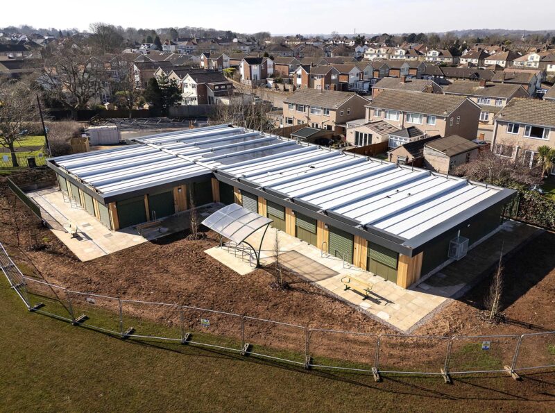 Image of new sports pavilion modular building with playing fields and a hub for players